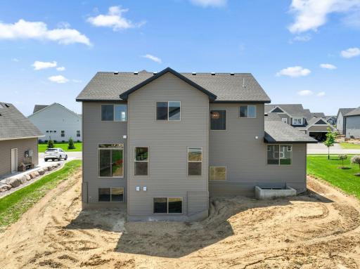 Irrigation, sod and trees will be added to this home.