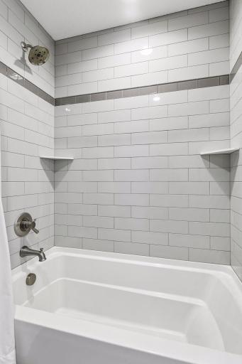jack and Jill shower features tiled shower with tub
