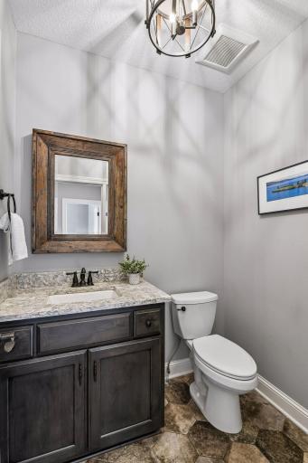 Main floor powder room just off the back entry