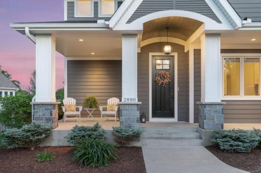 Stunning front entry with large front porch just a golf cart ride from Chaska Town Course.