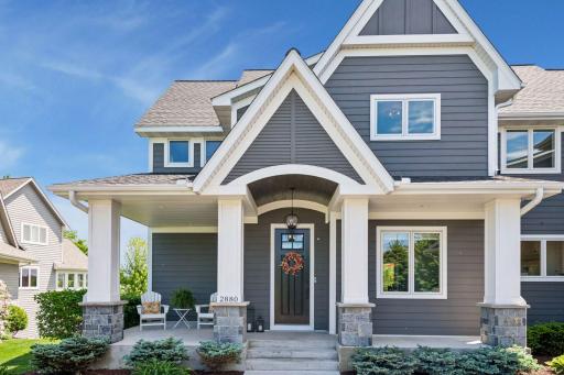 Stunning front entry with large front porch just a golf cart ride from Chaska Town Course.