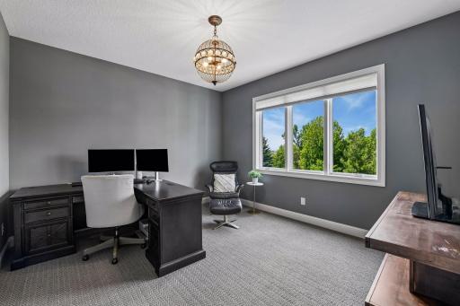 The second main-floor office is larger off the back mudroom