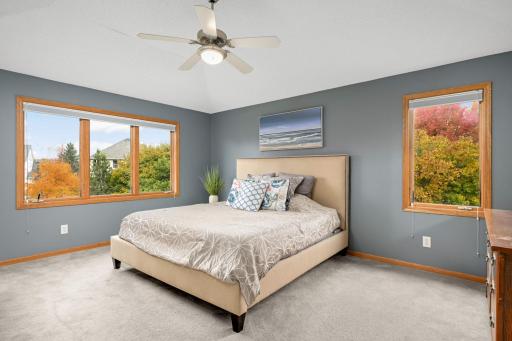 Primary suite has private bathroom and a walk-in closet.