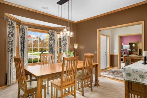 Formal dining room with updated light fixtures..
