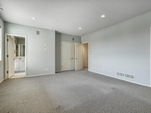 Private bath enhances the functionality and privacy of this bedroom