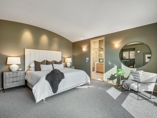 Expansive main-floor primary suite combining comfort, style, and convenience
