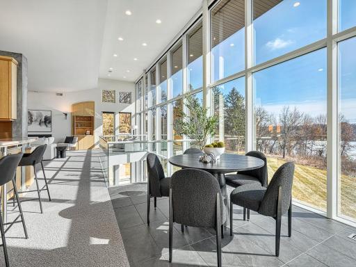 Uninterrupted views of the lake from this informal dining space