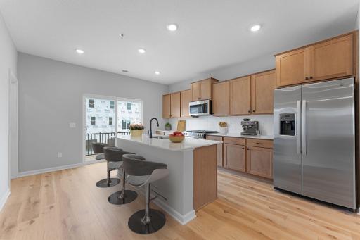 Photo for 14586 Rhinestone Street NW, Ramsey, MN 55303 - listing #6811959 The kitchen has timeless finishes that blend an elevated feel with functionality.