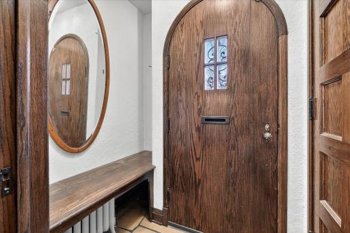 Beautiful arched doorway - signature feature of the Spanish Revival architecture style.