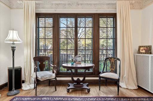 Living room gets a ton of natural light with floor to ceiling windows!