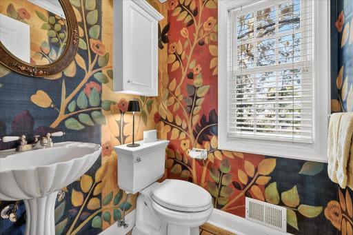 Main floor bathroom was custom painted by local artist.