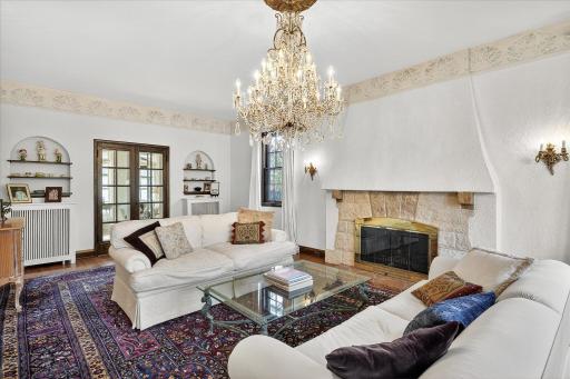 Large living room has an attached 3-season proch.