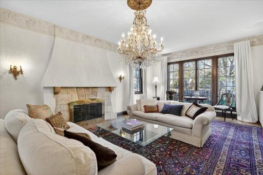 Large sunken living room with floor to ceiling windows! Note: Wood burning fireplace has been sealed and is not used by current owners.