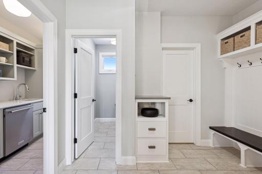 Back hall from garage with nice mud room space, walk in closet, powder bath and a prep kitchen / butlers pantry.