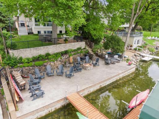 Lakeside patio - full width with sand bottom lakeshore. 5125 Greenwood Circle - Spacecrafting - 0004.jpg