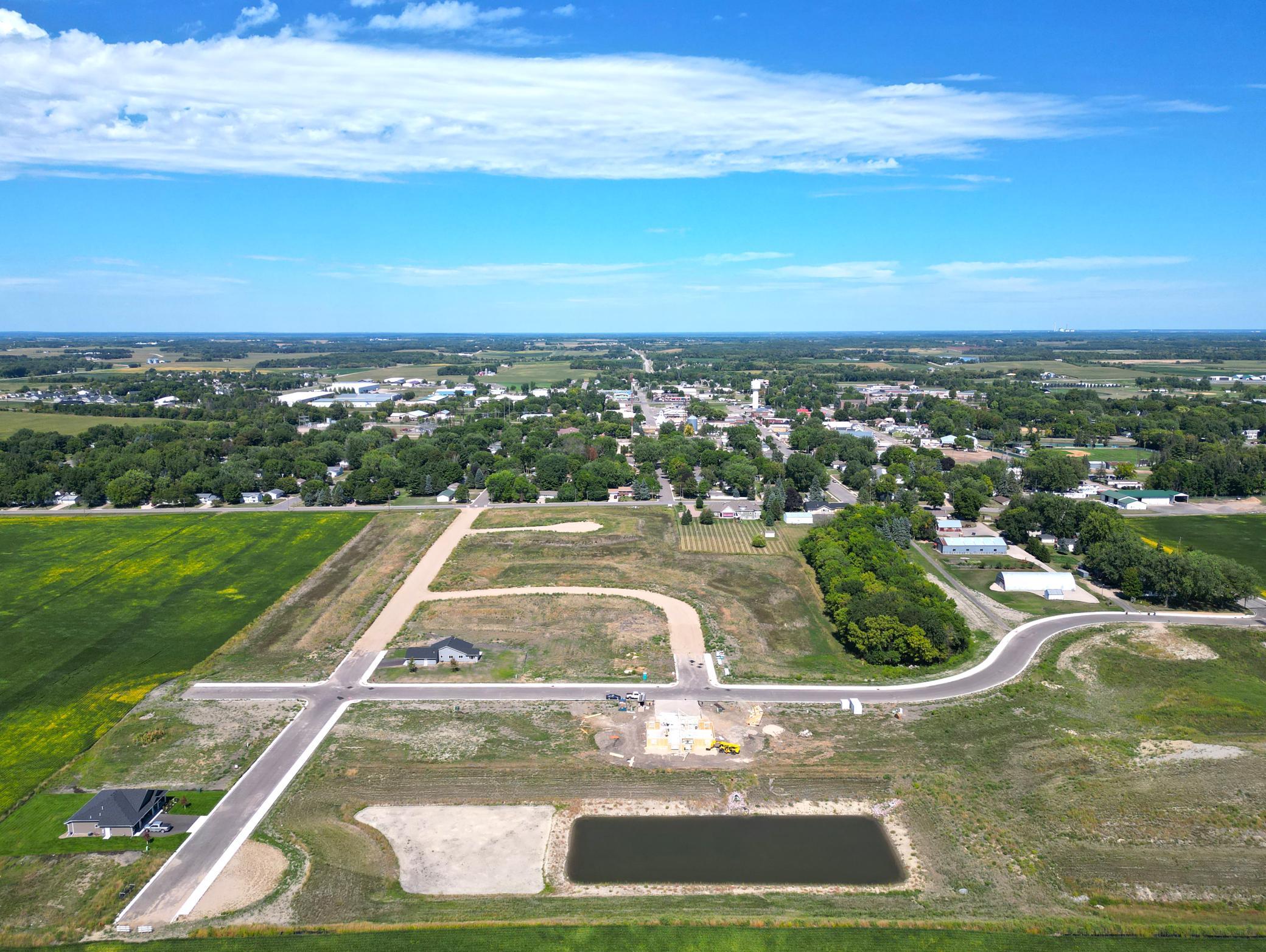 The 1st phase of roads are in and and the development is starting to take shape. Sidewalks have been added and walking trail will be in. Future park will be next to the walking trail and near the apartment site.