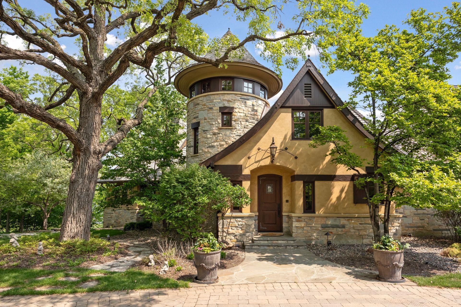 Enjoy a private entrance and home tucked off the cul-de-sac location; paver driveway is heated