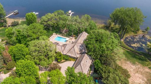 Heavily wooded lot, dock, boat house and 185' shoreline on Bryant Lake