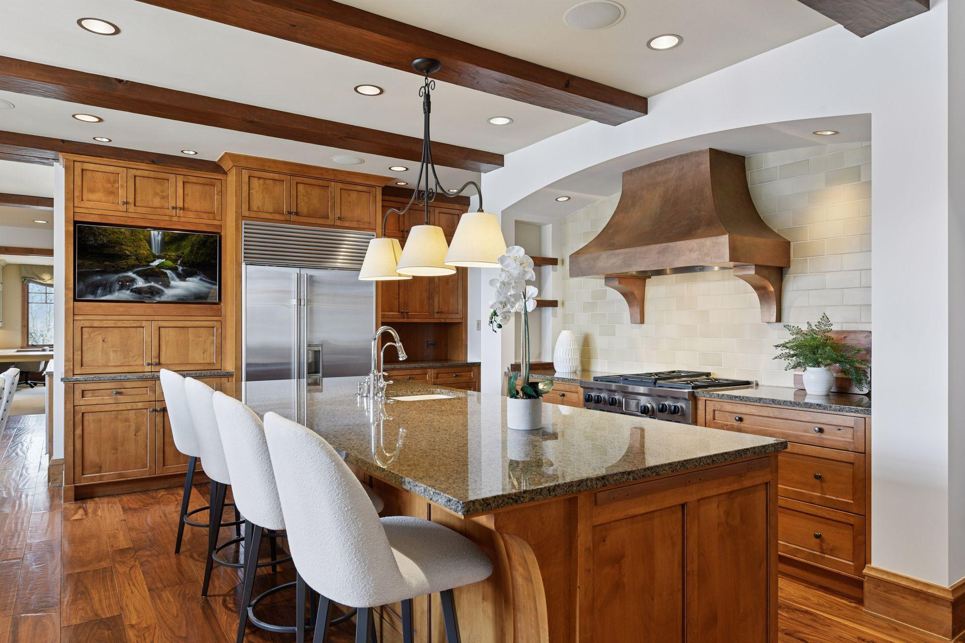 Granite, stone, tile, and wood are all design elements found in the kitchen