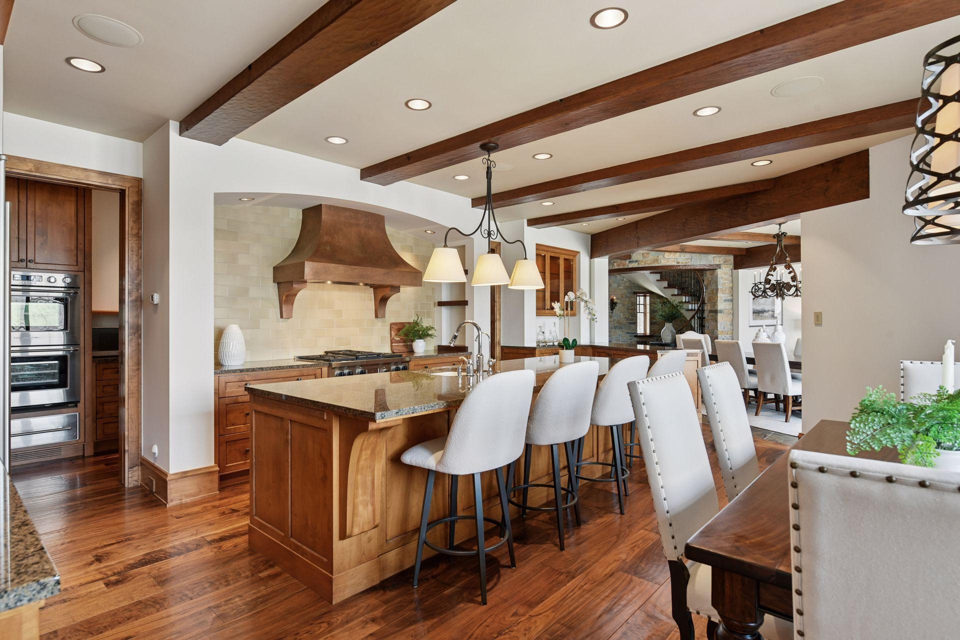 Large center island is ideal for meal prep, quick bite to eat, and laying out a buffet when entertaining