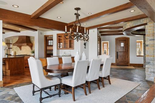 Formal dining area with wood beamed ceilings
