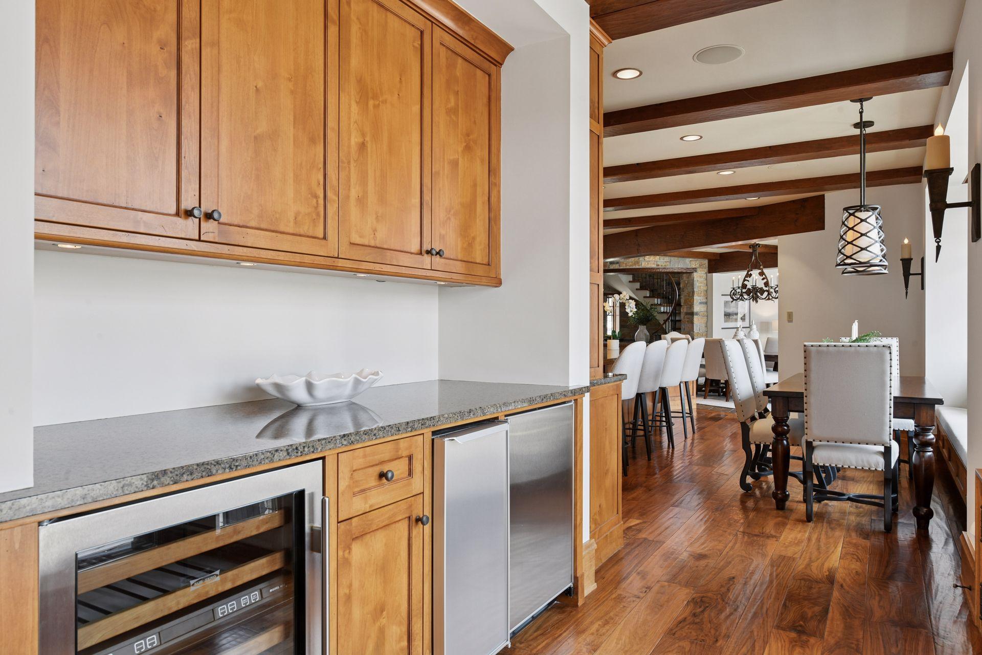 This hallway off the kitchen features a wine and beverage fridge plus ample extra storage