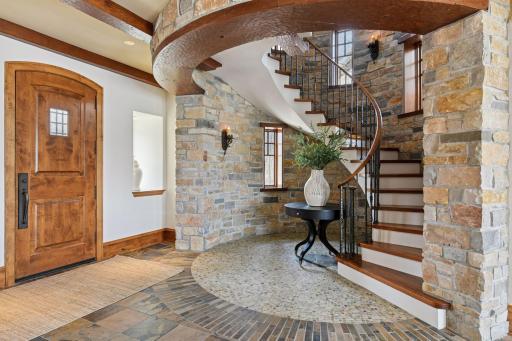 Staircase in the foyer leads to an upper level bonus room