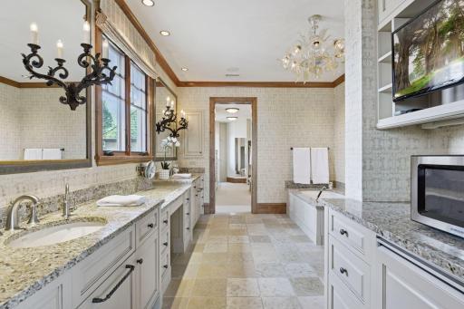 Primary bath with double vanities, whirlpool tub, large walk-in shower, heated floors, plus room for coffee station