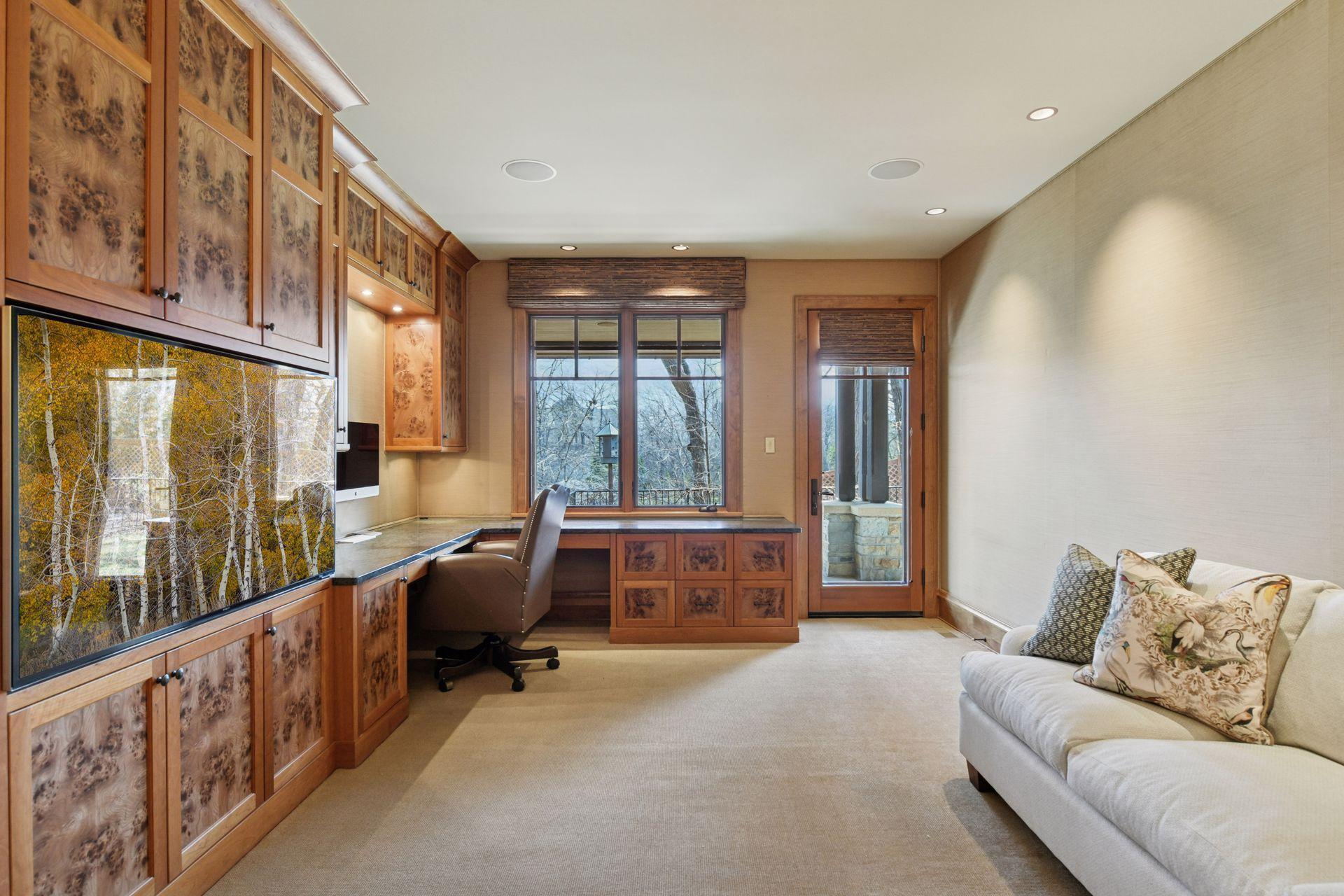 Main floor office with walk-out access to patio; conforming bedroom space