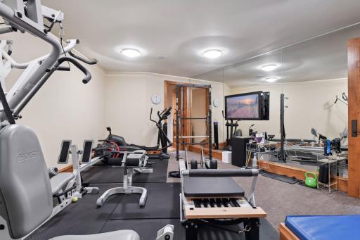 Spacious exercise room with mirrored walls
