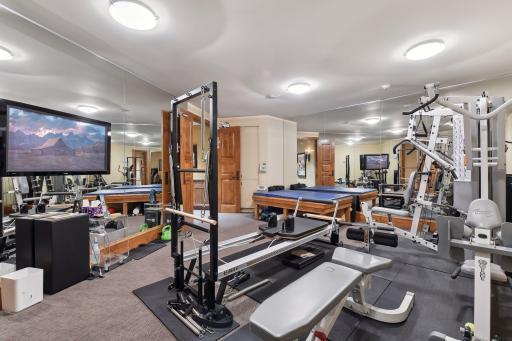 Spacious exercise room with mirrored walls