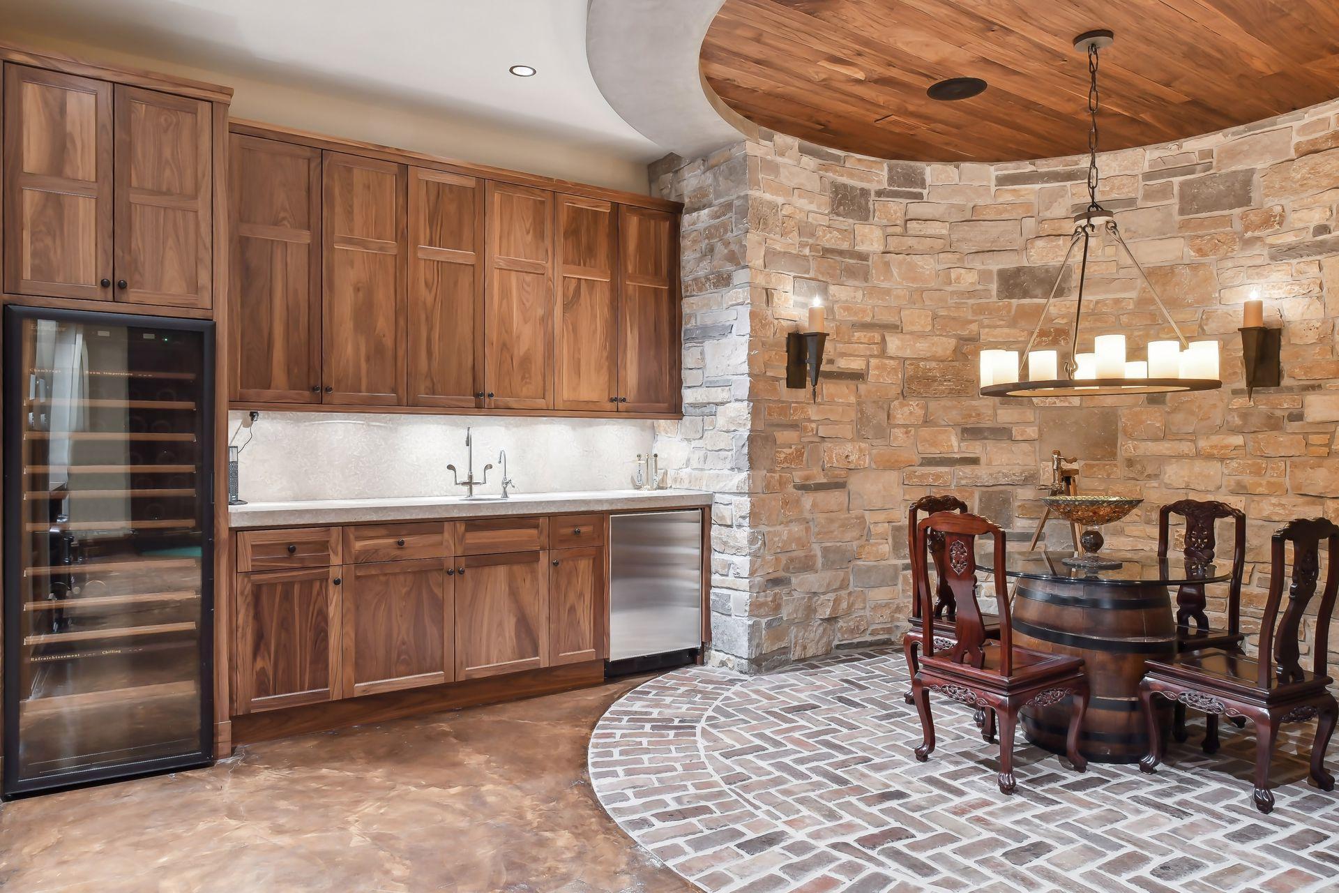 Complete with wine refrigerator and incredible stone work