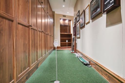 Putting green tucked just around from the golf simulator