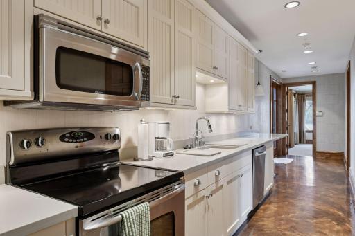 Lower level full kitchen comes in handy when entertaining on this level