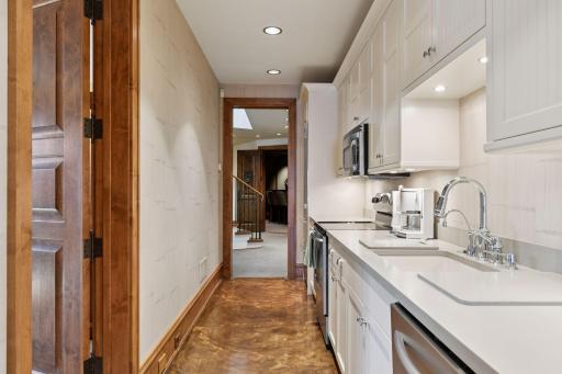 Lower level kitchen galley is located just off from the bedrooms, making it easy to grab a coffee first thing in the morning