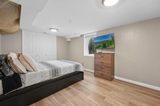 Guest bedroom with an egress window and large closet