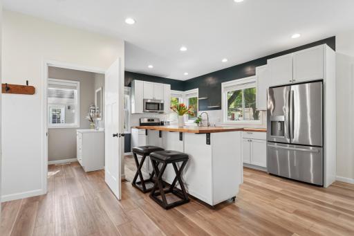 The nearby full main-level bathroom provides practical convenience and easy accessibility