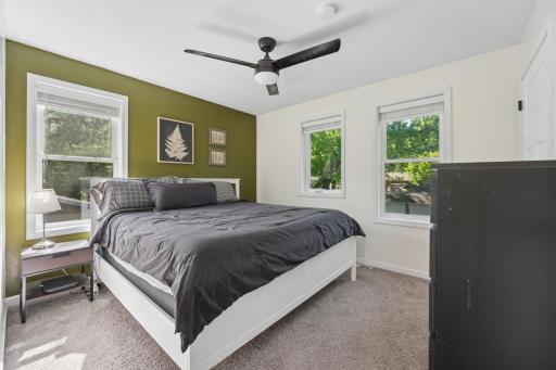 The primary bedroom combines comfort and functionality with a well-sized walk-in closet