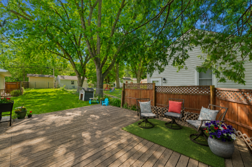The tree-lined, south-facing deck offers a wonderful sense of privacy and provides the perfect setting to relax and enjoy the warmer months