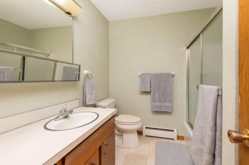 Very clean bathroom with updated tile flooring. There is also a linen/storage closet just out in the hallway.