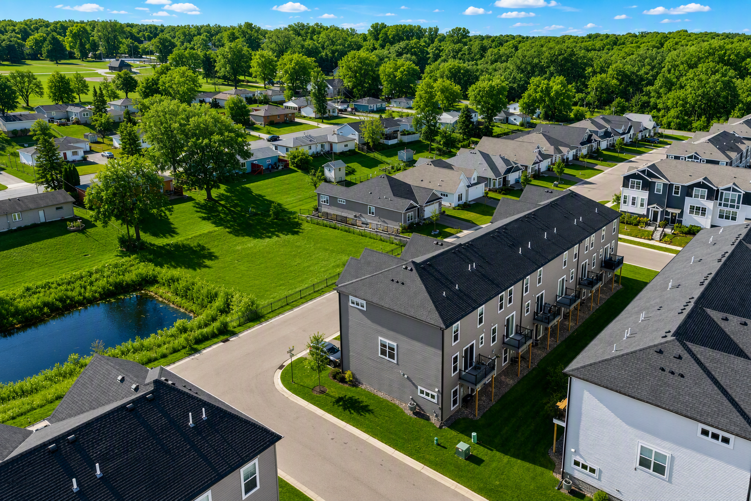 Drone view highlighting the home’s location within the community. Easy access to walking paths, open areas and nearby parks.