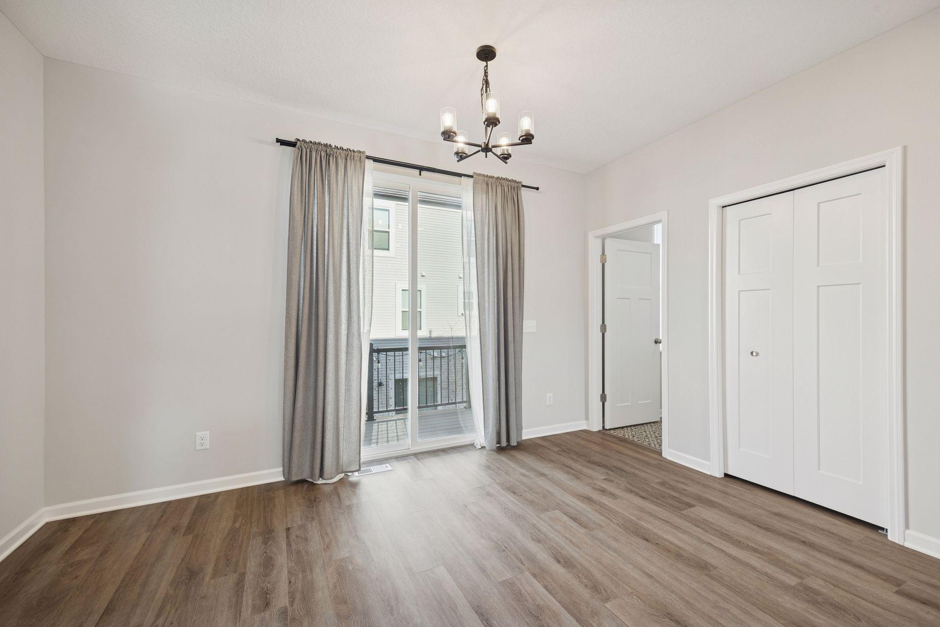 Main level dining area with deck access, offering a great spot for coffee or outdoor dining.