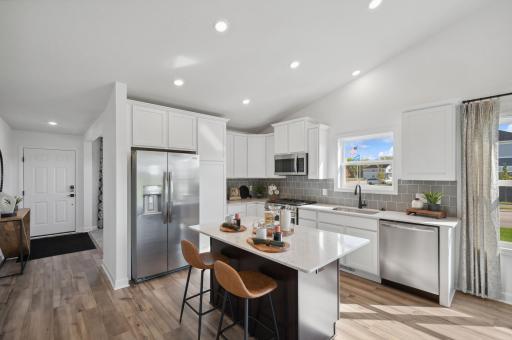 Picture of a model home with the same floorplan and similar features. Welcome to the Courtland kitchen