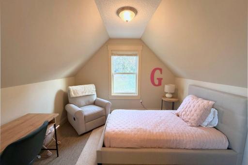 42. Bedroom 2 with bonus loft over garage.jpg