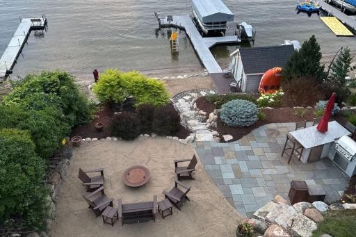 9. Outdoor Living_ Professionally designed outdoor spaces include tiered patios, tiered beach area, fire pit, and built-in audio â all oriented toward the lakeâs sunset.jpg