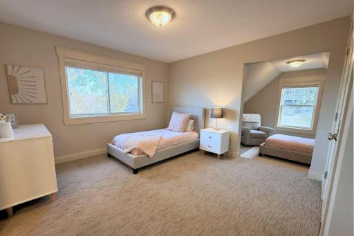 41. Bedroom 2 with bonus loft over garage.jpg