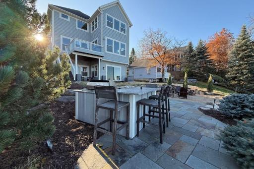 10. Outdoor Living_ Professionally designed outdoor spaces include tiered patios, tiered beach area, fire pit, and built-in audio â all oriented toward the lakeâs sunset.jpg