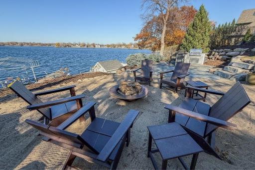 12. Outdoor Living_ Professionally designed outdoor spaces include tiered patios, tiered beach area, fire pit, and built-in audio â all oriented toward the lakeâs sunset.jpg