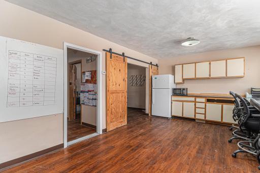 Large work space with three separate offices and half bath.