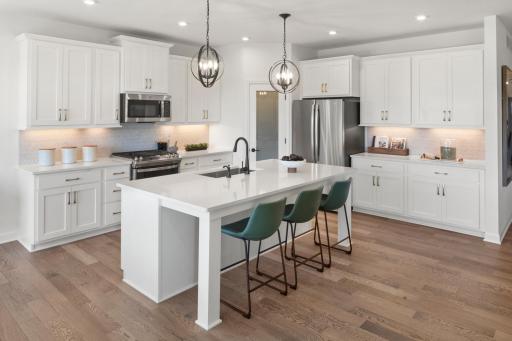 Welcome to your new Amelia Floorplan by M/I Homes at Rush Hollow North in Maple Grove! (Picture of model home, materials, layout and colors may vary.)